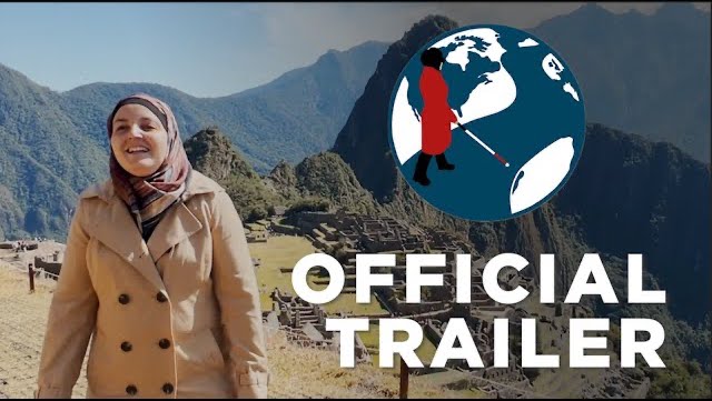 Mona smiling as she takes a water taxi over a river. In the top left corner is the PTC Logo. A cartoon Mona with her cane walking across a street on a globe.  